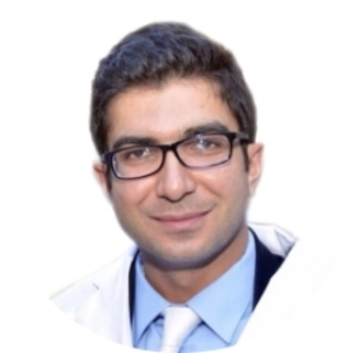 A Portrait Of Young Gentleman Looking At Camera