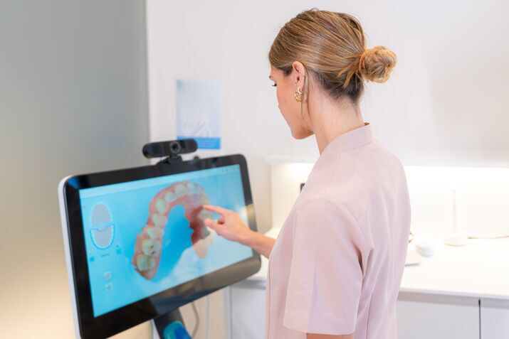 Dentist reviewing a dental X-ray