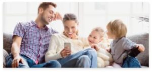 Family Picture with their Children watching on their Phone