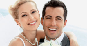 New Married Couple Smile to the Camera