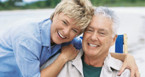Old Married Couple Enjoying each other at the Beach