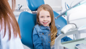 A Cute Girl Sitting in a Dentist Chair
